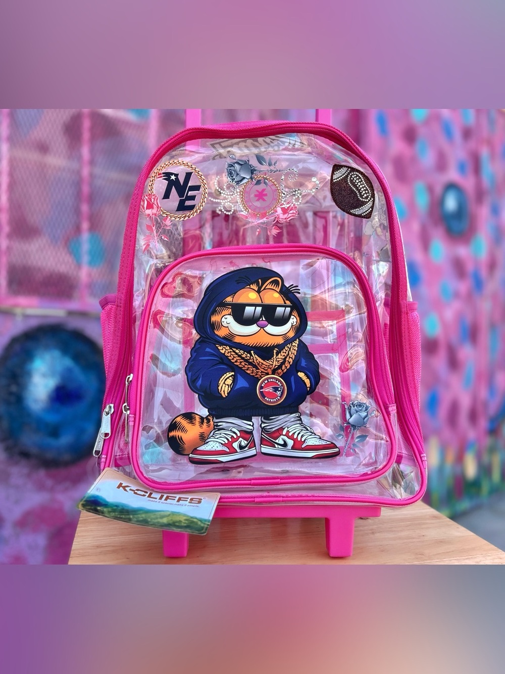 PATRIOTS FOOTBALL Clear Rolling Backpack 17” - Pink w/ Rhinestones (Garfield)